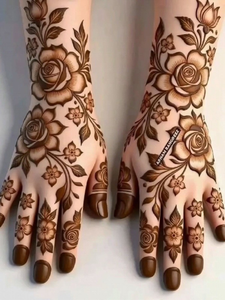 Bridal hands covered in rose mehendi
